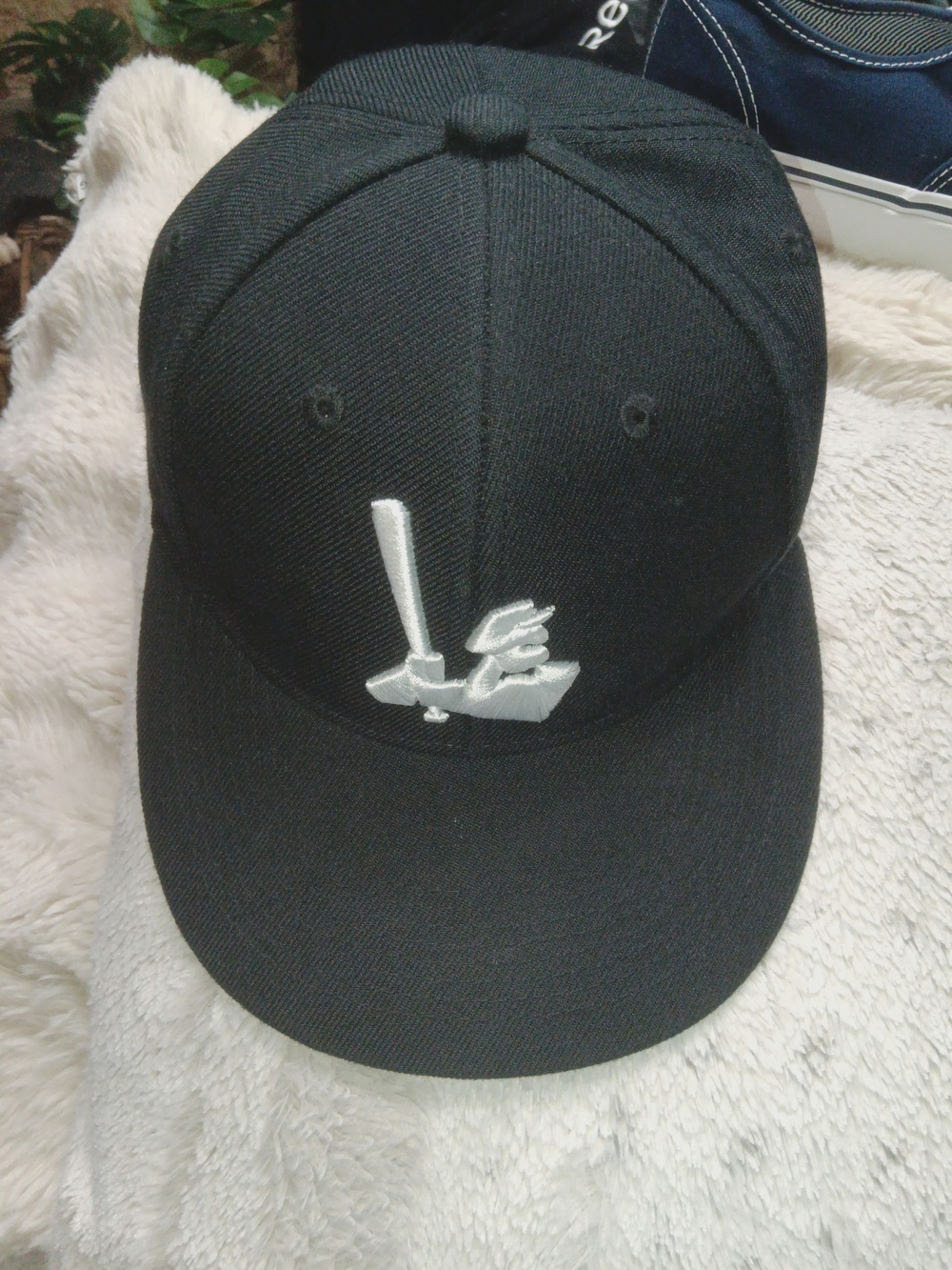 Milwaukee Milkmen baseball cap featuring an embroidered white silhouette of thei